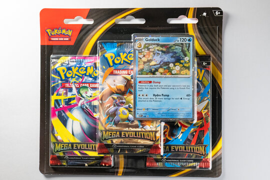 Bradford, UK - Nov 18 2025 : Pok&eacute;mon trading card game triple Mega Exolution pack with Golduck being shown on the front.
