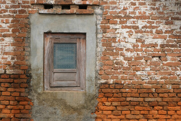 Corroded red brick wall house with wooden windows. Natural abstract patterns and textures. For graphic design, 3D rendering and banners