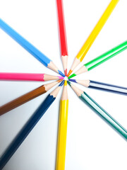 Colored pencils placed on a white background