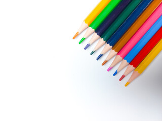Colored pencils placed on a white background