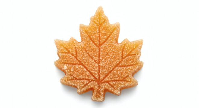 Pure maple sugar candy in maple leaf shape, isolated on white