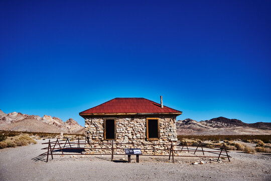 A preserved stone house in the Rhyolite ghost town, an early 1900s gold rush town in Nevada near the edge of Death Valley National Park