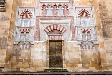 Mosque Cathedral of Cordoba - the Great Mosque in Cordoba, Andalusia, Spain. Al-Hakam II doors - Puerta de San Ildefonso on western wall from 10th century
