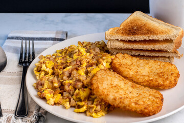 scramble eggs  and corn beef hash withhash browns