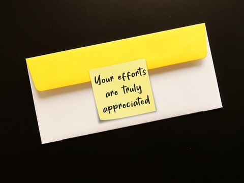 Office envelope with note written YOUR EFFORTS ARE TRULY APPRECIATED -Employee Recognition or acknowledging rewarding employees for contributions effort and achievements to show they are valued
