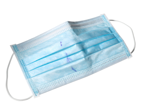 Used blue surgical medical face mask with ear loops and light stains on isolated background