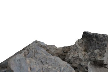 Close-up of weathered, grey rock formations, possibly mountain peaks, with a sharp, irregular outline against a stark black void above. Rugged natural texture