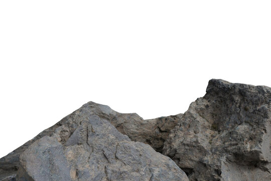 Close-up of weathered, grey rock formations, possibly mountain peaks, with a sharp, irregular outline against a stark black void above. Rugged natural texture