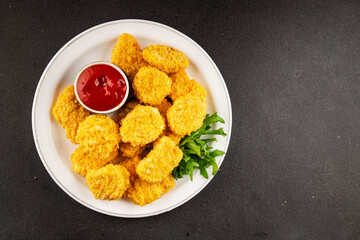 Chicken nuggets fast food natural tasty appetizer fresh delicious gourmet food background on the table rustic top view copy space