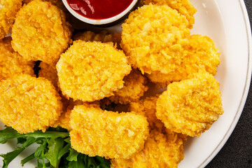 Chicken nuggets fast food natural tasty appetizer fresh delicious gourmet food background on the table rustic top view copy space