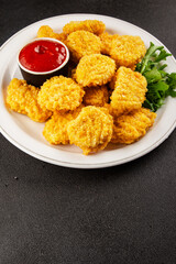 Chicken nuggets fast food natural tasty appetizer fresh delicious gourmet food background on the table rustic top view copy space