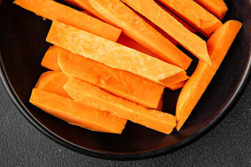 Raw sweet potato slices tasty snack fresh delicious gourmet food table background rustic top view...