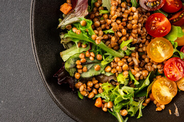 Lentil salad vegetables, tomato, green leaf lettuce tasty snack fresh delicious gourmet food table setting rustic top view copy space keto and paleo diet vegetarian and vegan food