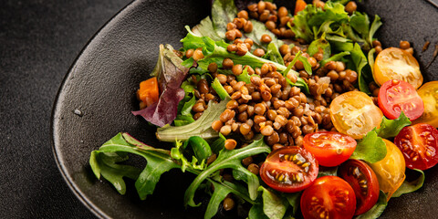 Lentil salad vegetables, tomato, green leaf lettuce tasty snack fresh delicious gourmet food table setting rustic top view copy space keto and paleo diet vegetarian and vegan food