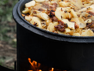 Potatoes are fried on the grill