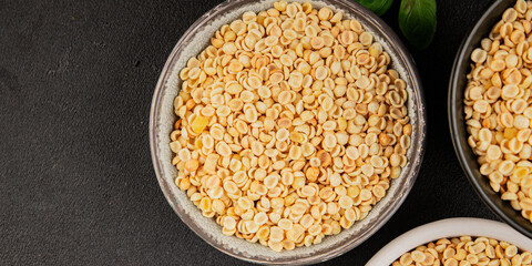 Orecchiette small pasta drum wheat pasta Italian food tasty snack fresh delicious gourmet food table setting rustic top view copy space