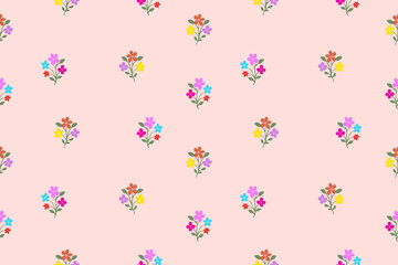 Soft pink background decorated with small, colorful floral bouquets arranged in a gentle repeating pattern, creating a cute and charming seamless design.