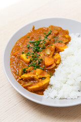 Close-up view of chicken curry with rice.