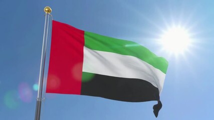 United arab emirates flag waving in sunny blue sky, vibrant colors