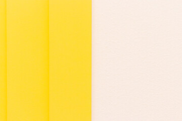 the image is divided perfectly down the middle. one half displays a gentle yellow hue, while the other remains bright white. The clean contrast creates a calm, minimalistic atmosphere and gives the co