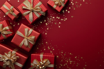 Elegant Red Gift Boxes with Gold Ribbons and Star Confetti Frame - Holiday Celebration Flat Lay