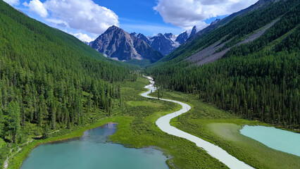 Drone flight over a mountain lake - Shavlinskoye blue lake in Altai