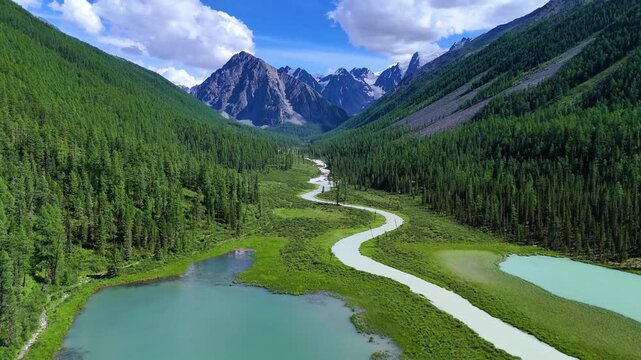 Drone flight over a mountain lake - Shavlinskoye blue lake in Altai