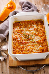 delicious homemade of butternut gratin with cheese and rosemary