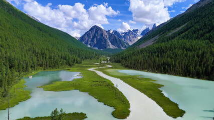 Drone flight over a mountain lake - Shavlinskoye blue lake in Altai