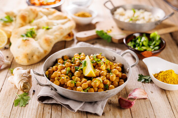 Indian dish, chickpea curry with rice and naan bread