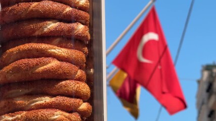 Close up of Simit bagels and Turkish flag reflecting local culture and identity