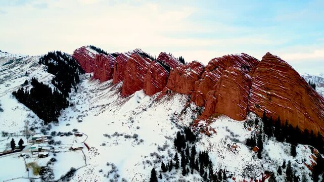 Jeti-Oguz gorge in winter, Seven Bulls Red Cliffs, Kyrgyzstan, winter snowy landscape, aerial drone footage