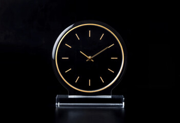 Luxury Minimalist Table Clock with Gold Details on Black Background