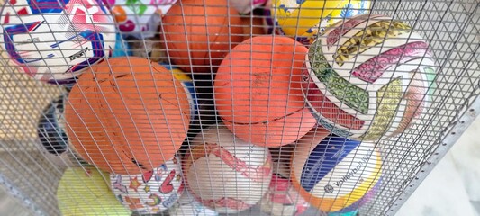 Colorful Sports Balls in Metal Storage Cage