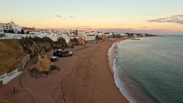 Panoramic Sunset View of Albufeira Beach and Old Town Static Shot from Top of Cliffs Algarve Faro Region Southern Portugal 4K GoPro Travel Footage