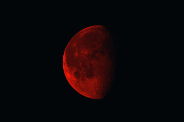 Dramatic blood moon with intricate surface detail against the pitch black sky, perfect for adding a sense of mystery and cosmic wonder to your project