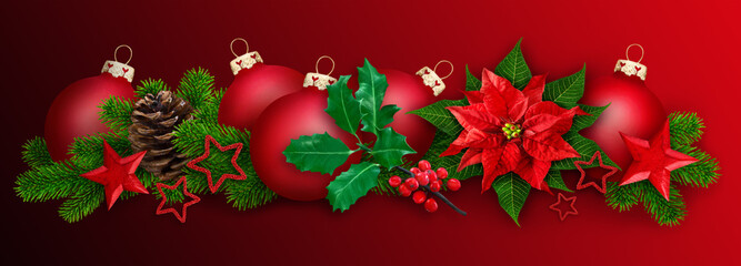 Red Christmas decoration with balls, winter rose and fir branches on red background