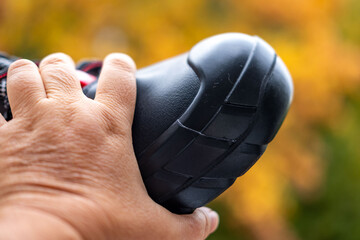 Closeup black heavy-duty work boots, special leather shoes details, durable material, reinforced steel toe, industrial safety footwear designed for construction and heavy-duty work, hard labor