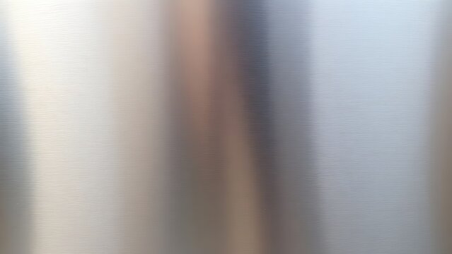 couter. Metal surface transitioning from rough matte to glossy finish with light reflections. safety posters, maintenance manuals, designed for precision metalworking and fabrication facilities.