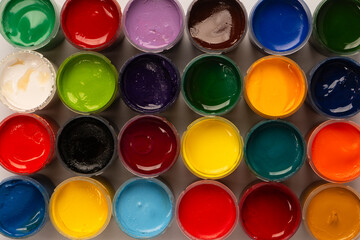 Gouache colorful paints set. Jars of gouache paint isolated on a white background.