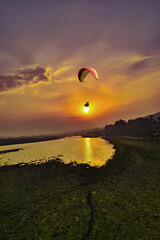 Paragliding over the clouds sunset view at Bir Billing Himachal Pradesh India. Clouds in the sky, Dhauladhar peaks view 5 pm 20 May 2025