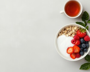 Clean breakfast spread with oat bowl, berries, and herbal tea, plantbased eating, serene morning vibe