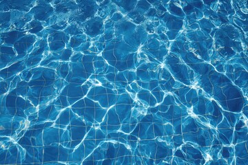 Obraz premium Close-up of rippling, azure water, reflecting sunlight over a tiled surface