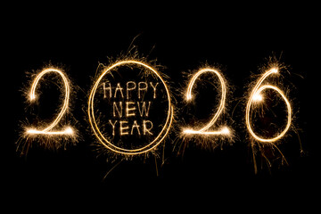 Happy New Year 2026. Burning sparkling text 2026 isolated on black background.