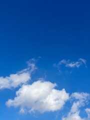 Blue sky and a single white cloud&rdquo;