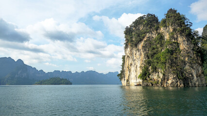 Cheow Lan Lake with limestone karsts rising from tranquil water, Khao Sok National Park, Ban Ta Khun, Thailand, Southeast Asia.