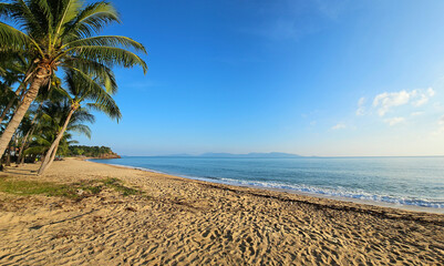 Mae Nam Beach with palm trees in the light of sunset, Island Ko Samui, Surat Thani, Thailand.