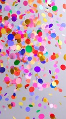 Fototapeta premium floating different color confetti on light background 