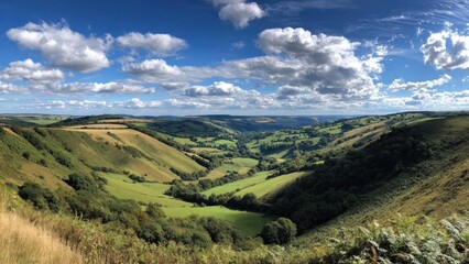Naklejka premium Scenic countryside with rolling green hills, patchwork fields, and a blue sky dotted with white clouds. Concept Pastoral Countryside, Rolling Green Hills, Patchwork Fields, Blue Sky, Fluffy Clouds