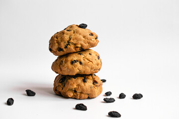 Stack cookies with raisins and nuts on white background. Photo fresh baked goods. For bakery recipe, food post, article or packaging.